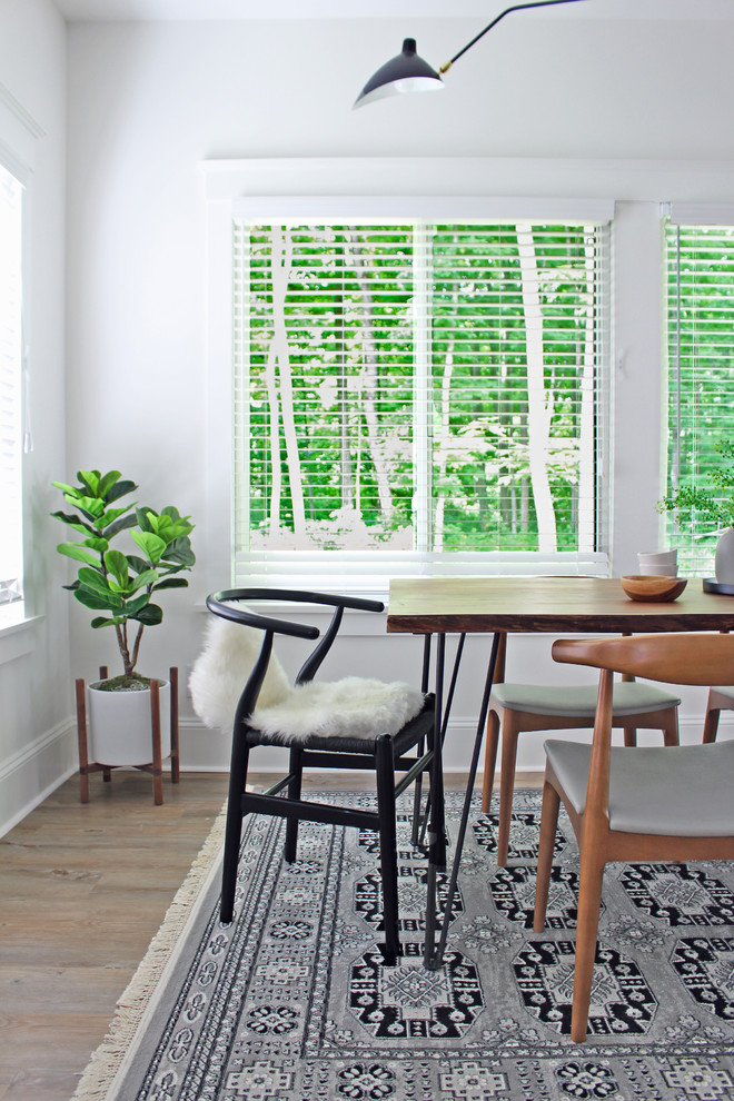 This is an example of a scandi dining room in Toronto.