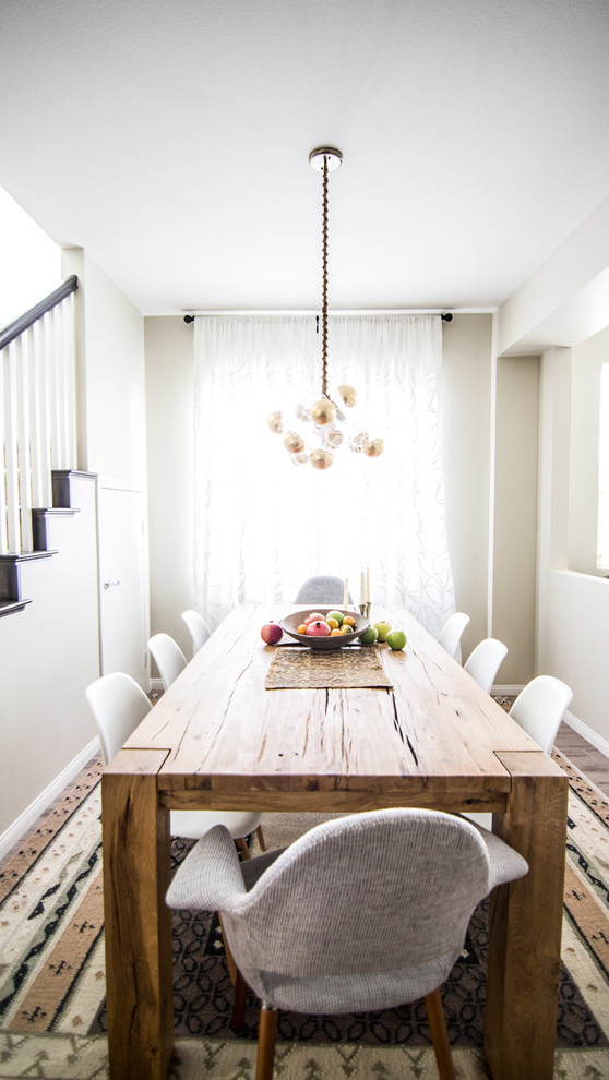 Inspiration for a small scandinavian dining room in Orange County with white walls and no fireplace.