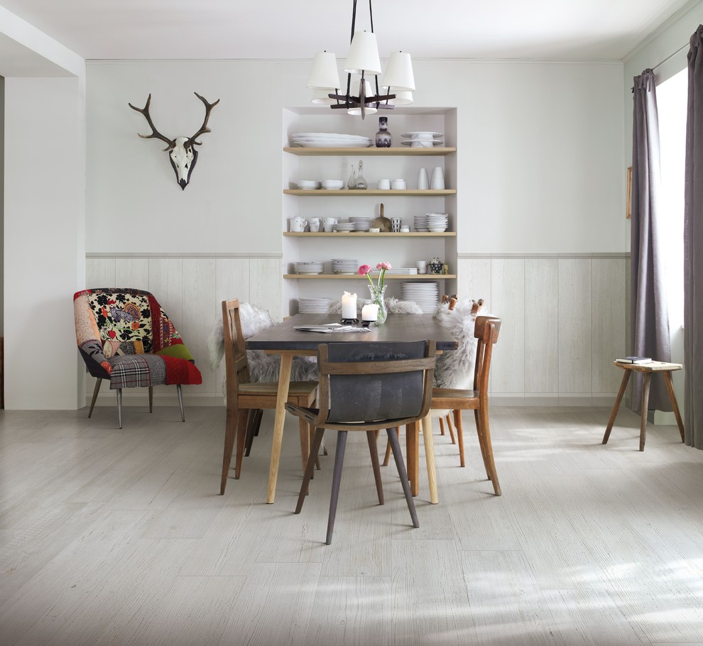 Scandinavian dining room in Dublin with porcelain flooring, white walls and grey floors.