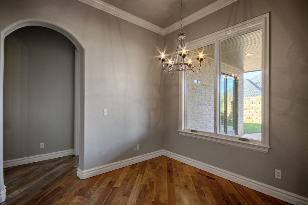 Medium sized modern kitchen/dining room in Oklahoma City with grey walls and medium hardwood flooring.