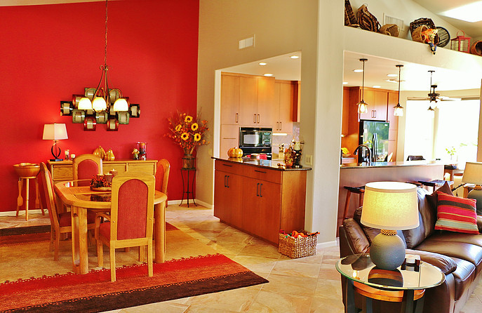 Inspiration for a medium sized mediterranean open plan dining room in Phoenix with orange walls and ceramic flooring.