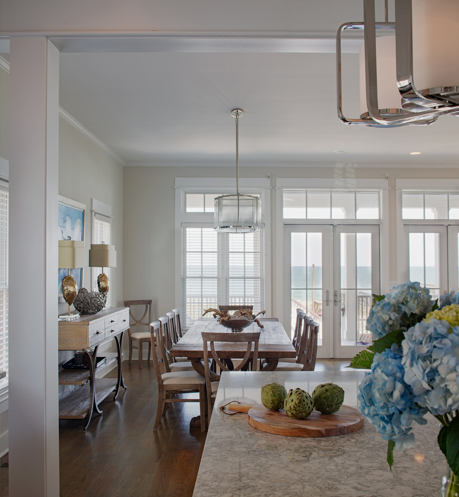 This is an example of a medium sized coastal open plan dining room in Charleston with beige walls, medium hardwood flooring, no fireplace and brown floors.
