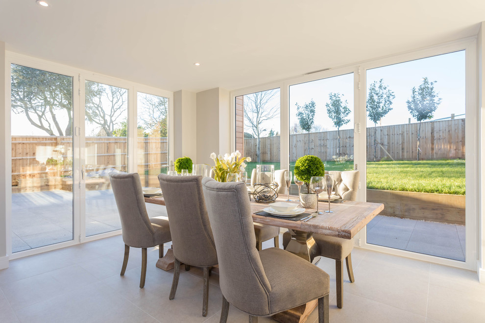 Inspiration for a medium sized contemporary open plan dining room in Buckinghamshire with ceramic flooring and no fireplace.