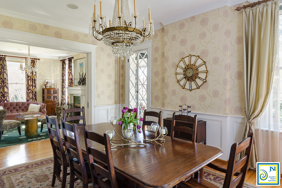 Example of a large classic medium tone wood floor and brown floor enclosed dining room design in Richmond with beige walls