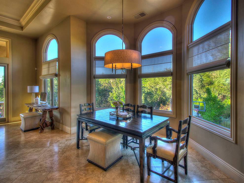 Example of a tuscan dining room design in Sacramento