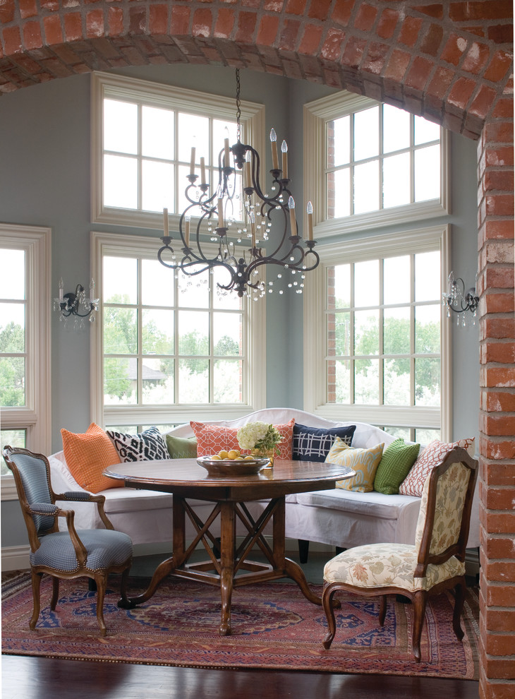 Example of a classic dining room design in Denver with blue walls