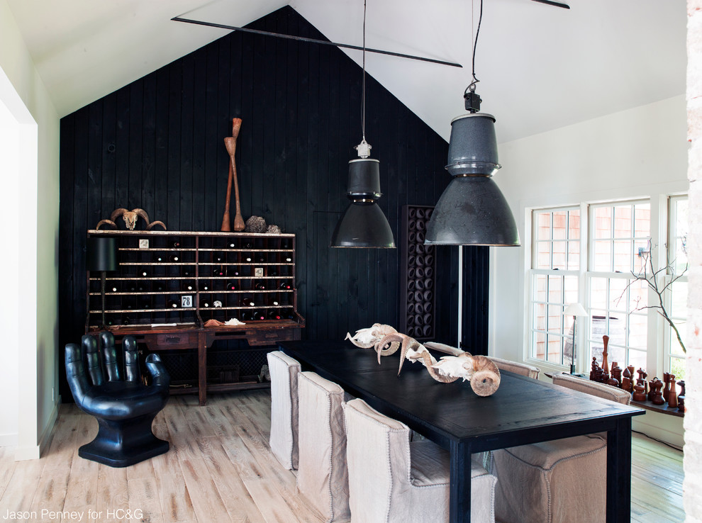 Inspiration for a nautical dining room in New York with black walls.