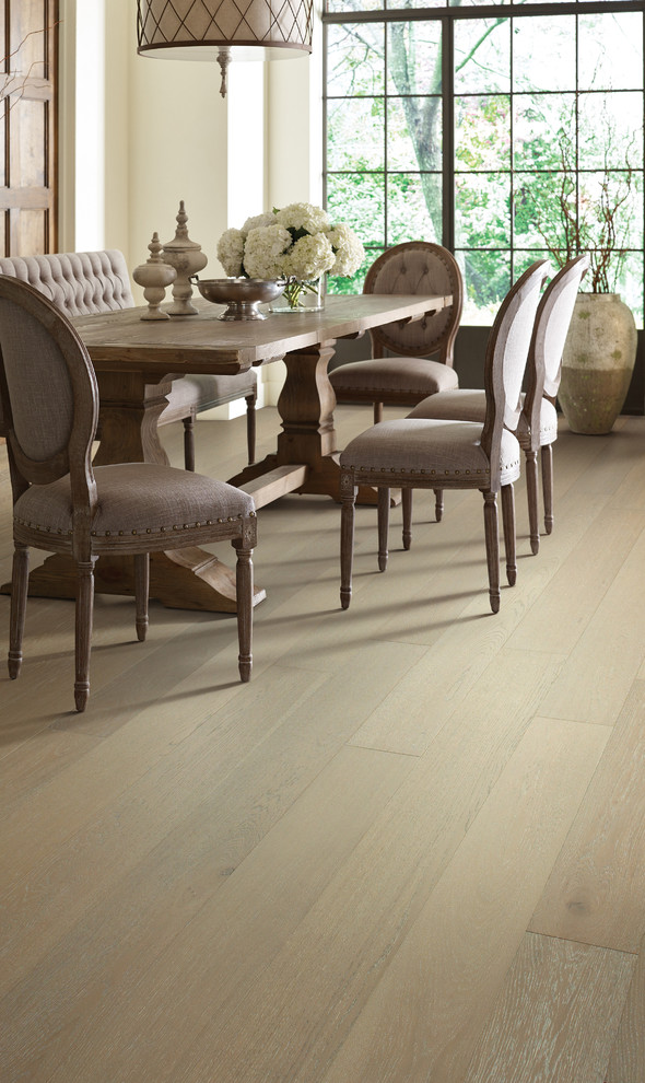 Inspiration for a large transitional medium tone wood floor dining room remodel in Orange County with beige walls