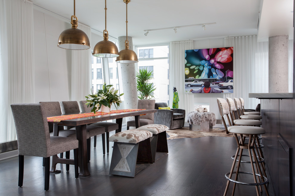 Photo of an urban open plan dining room in New York with white walls and dark hardwood flooring.