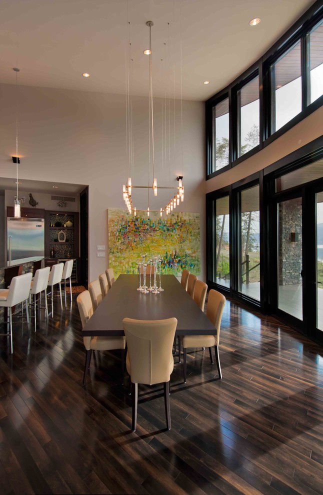 This is an example of a contemporary open plan dining room in Vancouver.