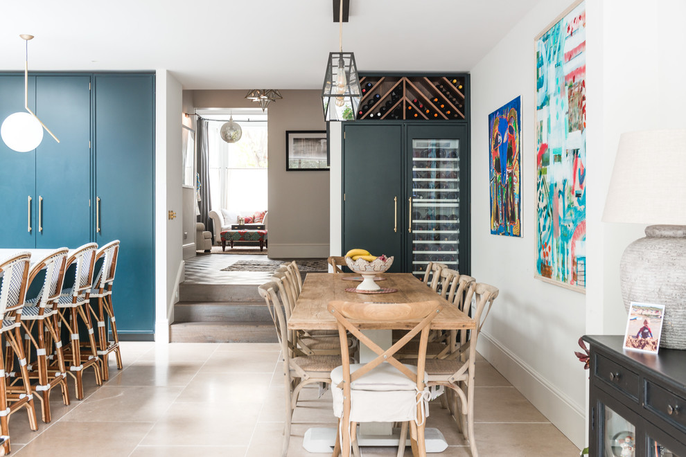 Design ideas for a large classic open plan dining room in London with beige floors and white walls.