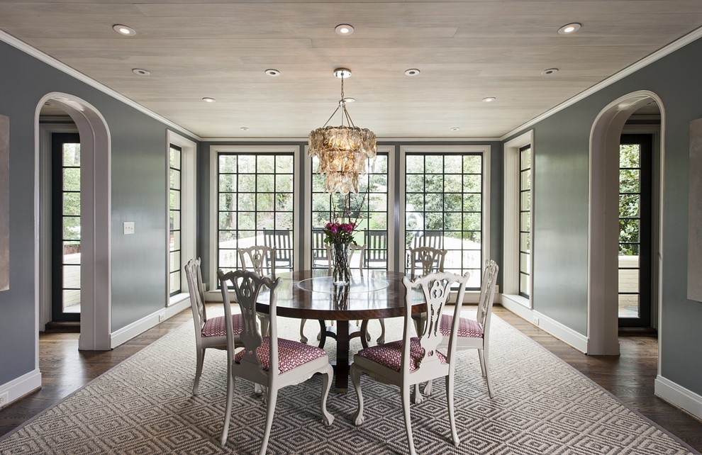 Example of a classic dark wood floor enclosed dining room design in Charlotte with gray walls and no fireplace