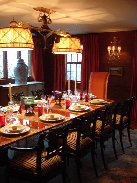 Mid-sized elegant medium tone wood floor enclosed dining room photo in Other