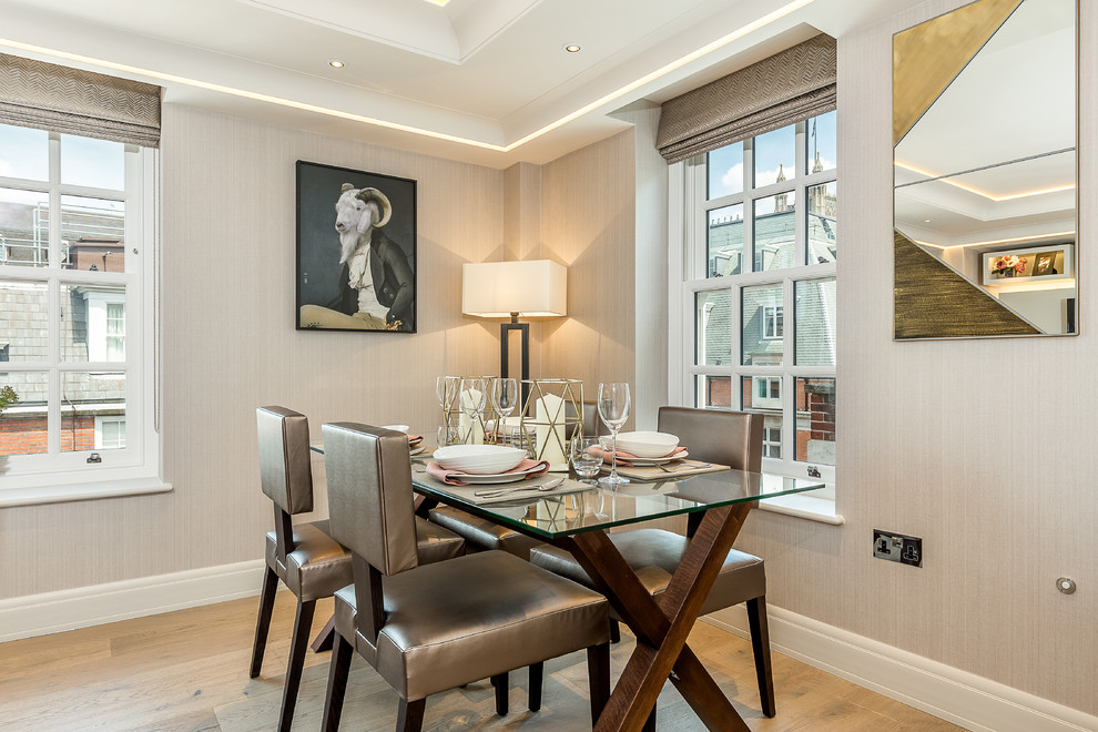 Inspiration for a contemporary dining room in London with beige walls.