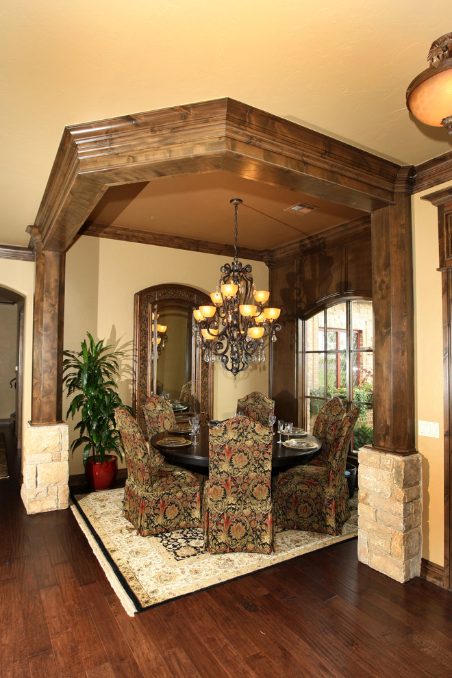 Design ideas for a medium sized mediterranean enclosed dining room in Oklahoma City with beige walls, dark hardwood flooring and no fireplace.
