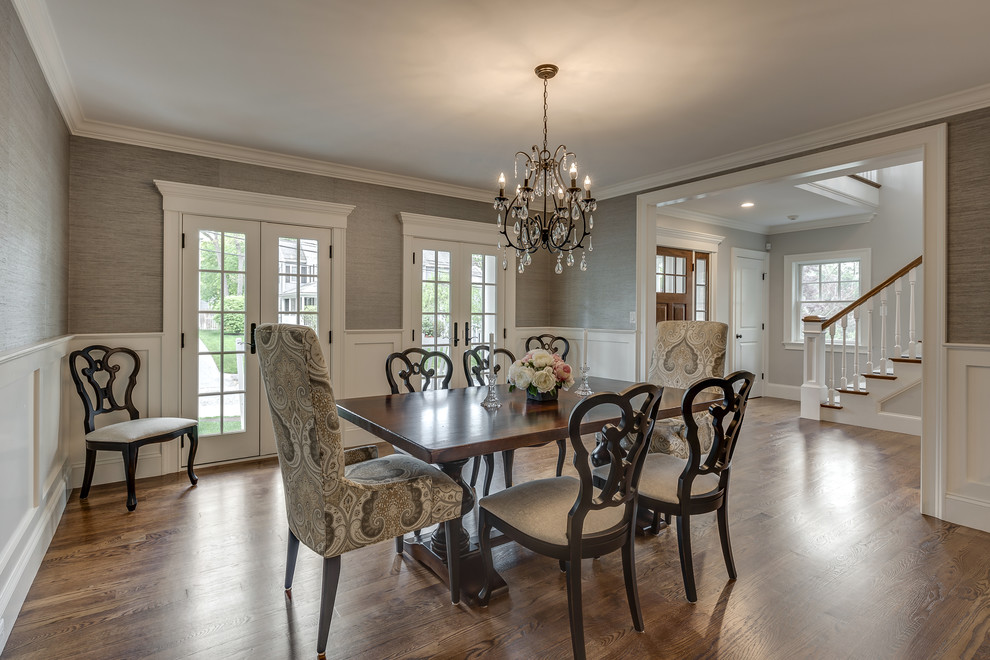 Inspiration for a timeless medium tone wood floor dining room remodel in Boston with gray walls