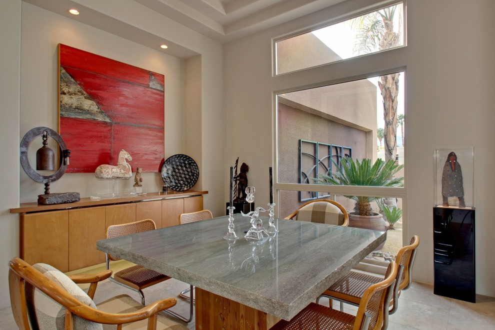 Photo of a mediterranean dining room in Los Angeles with white walls.