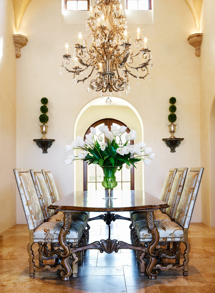 Design ideas for a large mediterranean open plan dining room in Phoenix with beige walls, travertine flooring and beige floors.