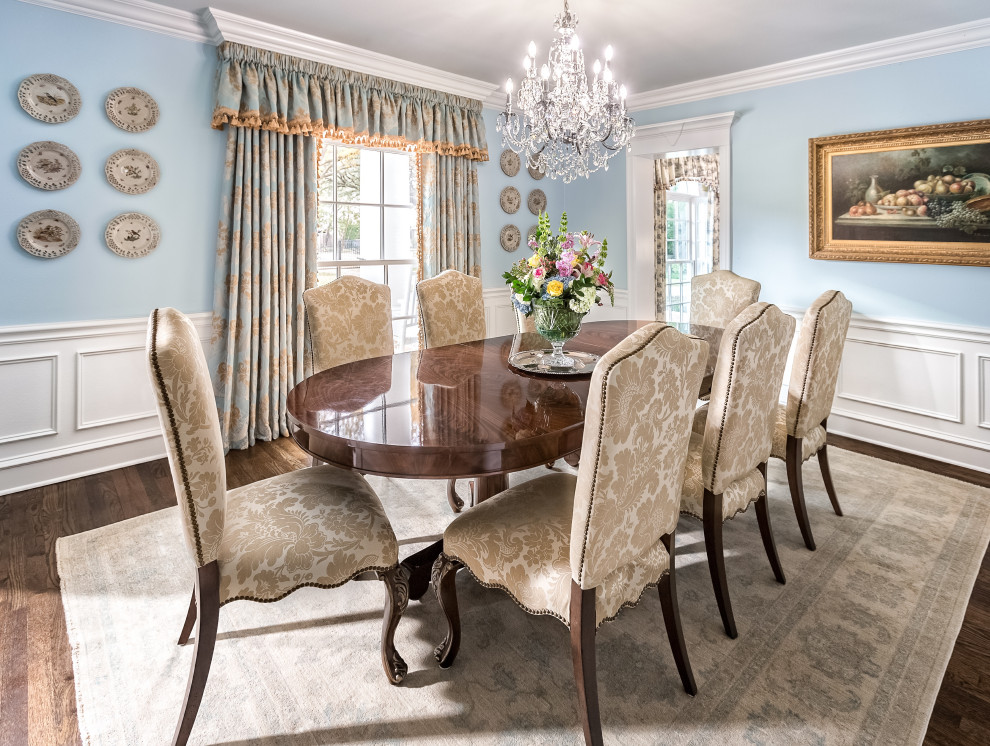 Huge elegant dark wood floor and brown floor dining room photo in Dallas with blue walls