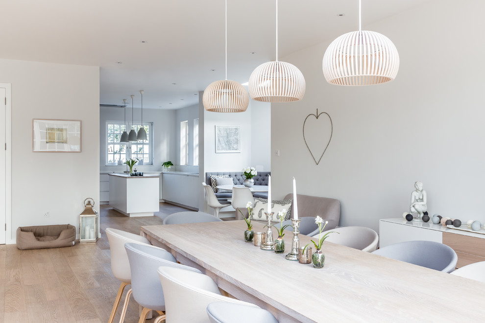 This is an example of a large scandi dining room in London.