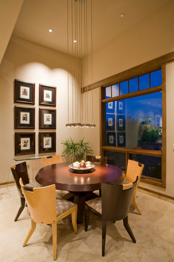 Dining room - mediterranean dining room idea in Phoenix with beige walls