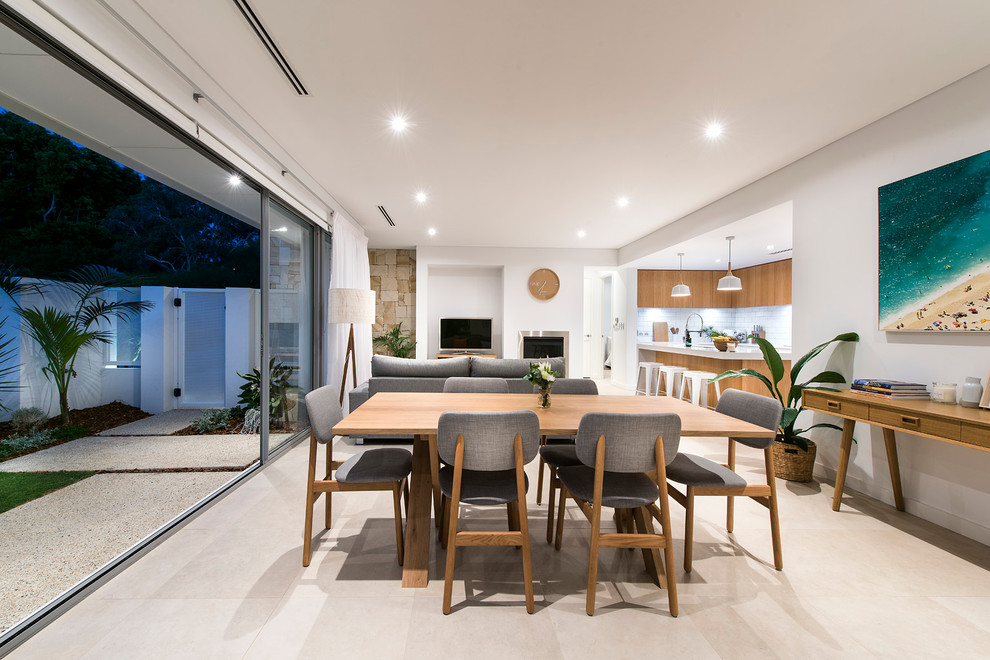 Стильный дизайн: кухня-столовая среднего размера в стиле модернизм с белыми стенами и полом из керамогранита - последний тренд
