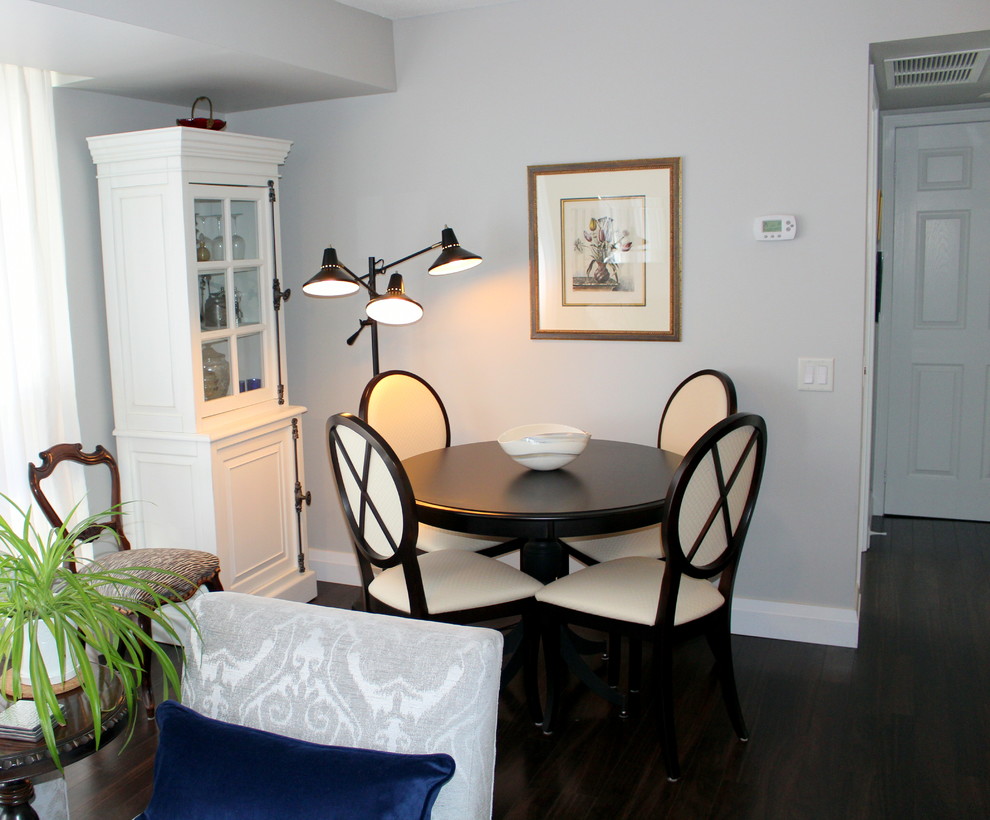This is an example of a small classic open plan dining room in Toronto with grey walls and dark hardwood flooring.