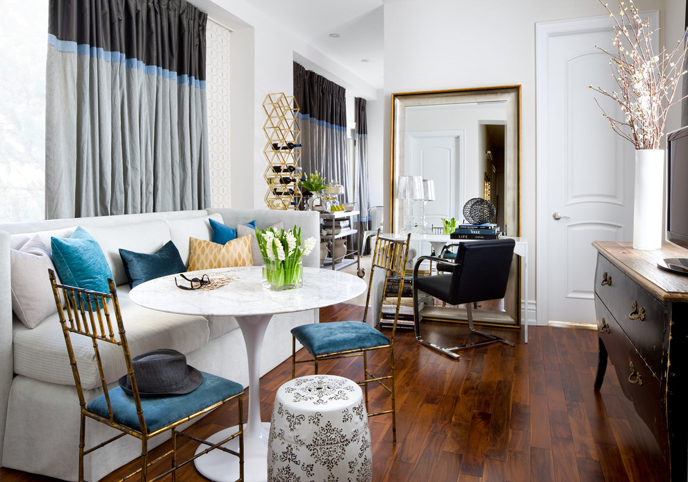 Example of an eclectic dark wood floor dining room design in Toronto with white walls