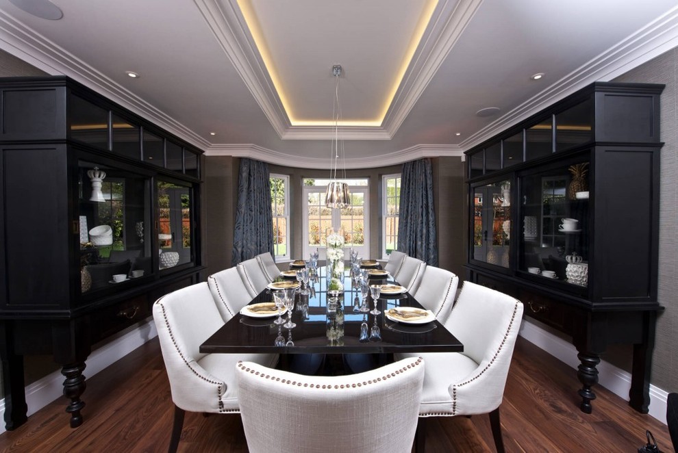 Photo of a large contemporary enclosed dining room in Sussex with grey walls and dark hardwood flooring.