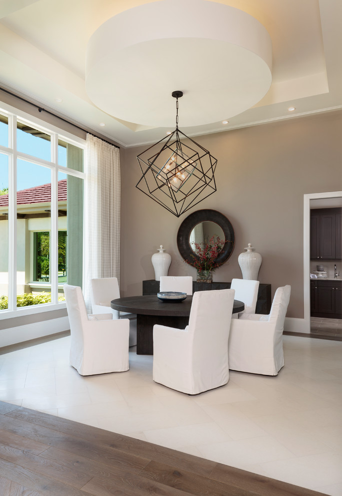 Inspiration for a medium sized contemporary enclosed dining room in Miami with brown walls, porcelain flooring, no fireplace and white floors.