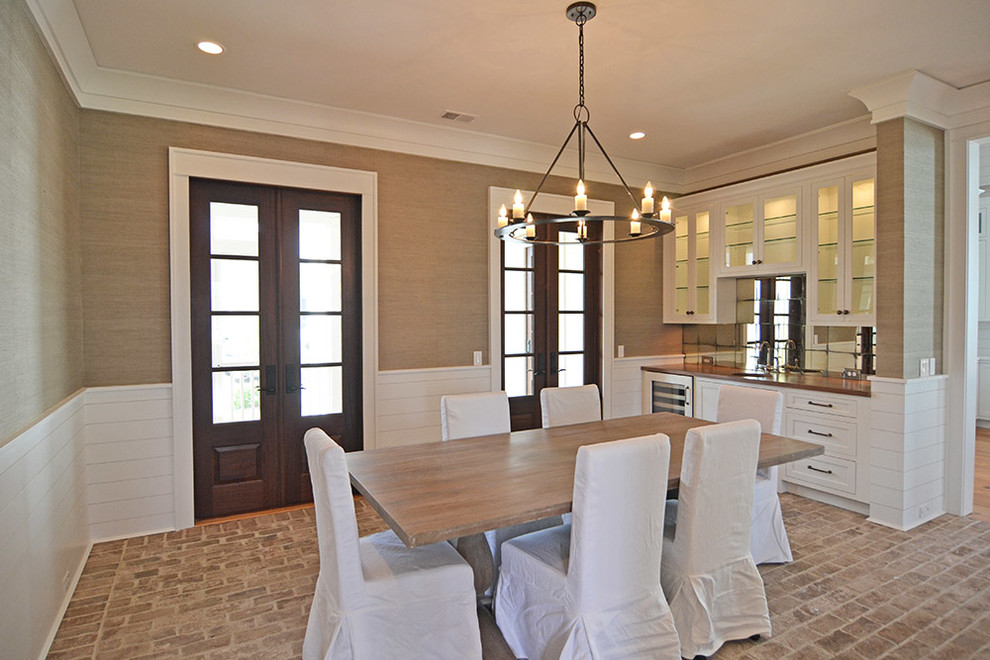 Photo of a nautical enclosed dining room in Charleston with grey walls, brick flooring and no fireplace.