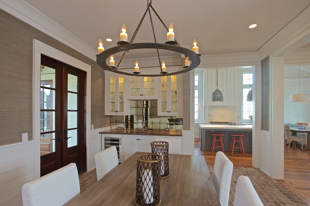 Example of a mid-sized brick floor kitchen/dining room combo design in Charleston with beige walls and no fireplace
