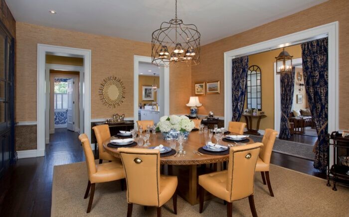 Large traditional enclosed dining room in Other with beige walls and dark hardwood flooring.