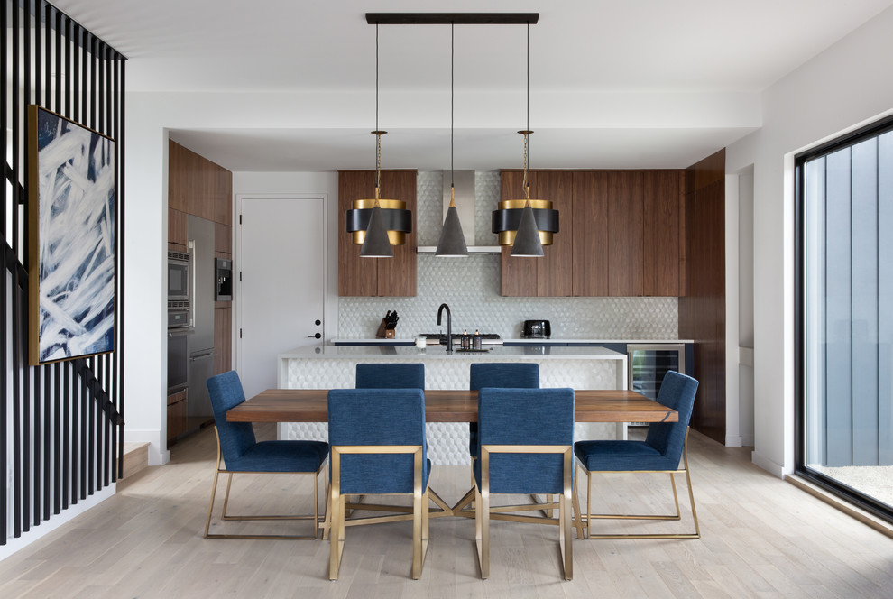 Inspiration for a small contemporary light wood floor and brown floor kitchen/dining room combo remodel in Austin with white walls and no fireplace