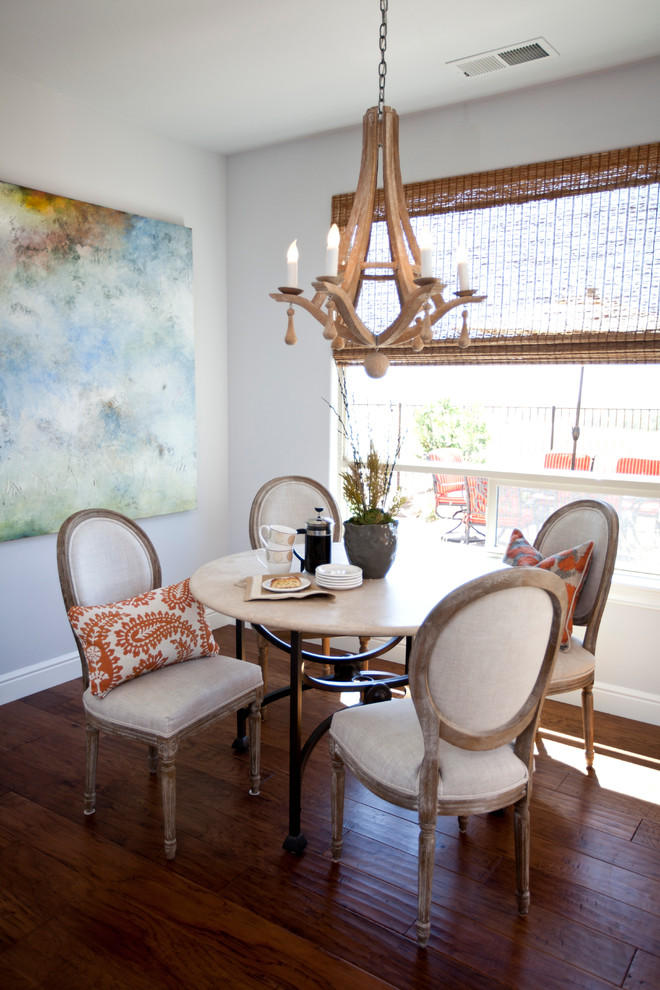 Inspiration for a contemporary dining room in Sacramento with white walls and dark hardwood flooring.