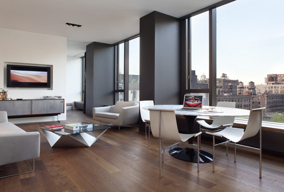 Modern open plan dining room in San Francisco with white walls.