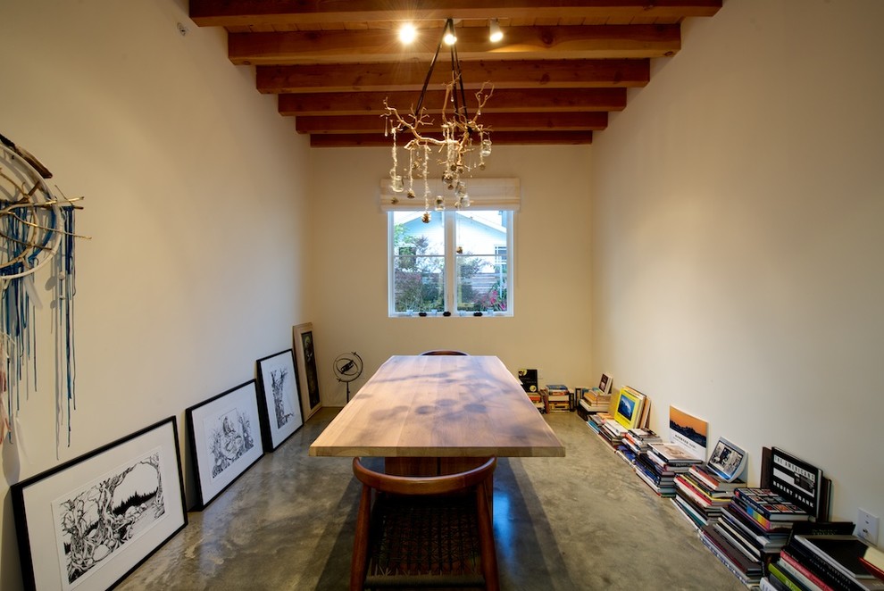 Dining room - coastal concrete floor dining room idea in San Diego with beige walls and no fireplace