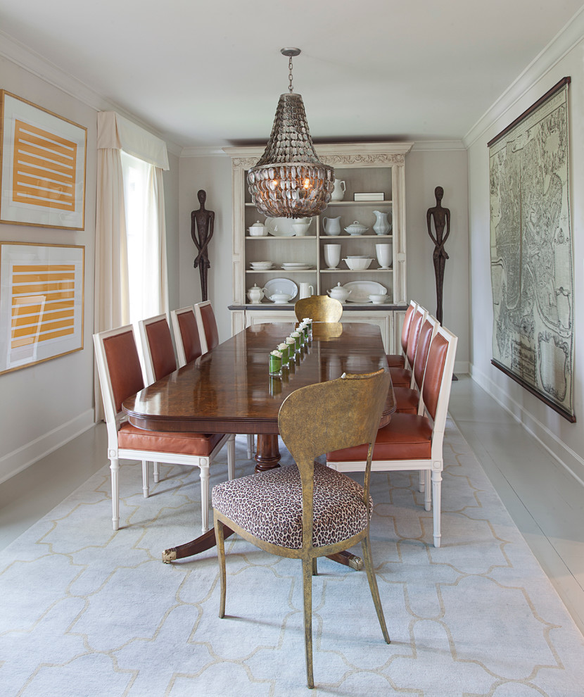 Traditional enclosed dining room in New Orleans with beige walls.