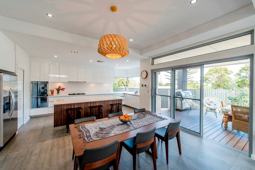 Photo of a contemporary dining room in Perth with white walls and no fireplace.