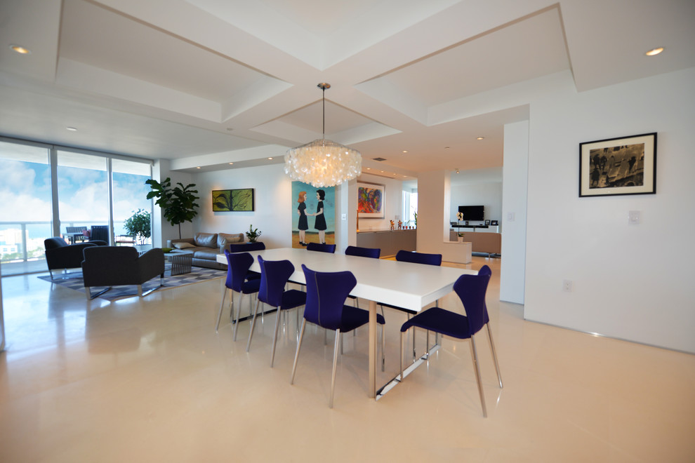 Inspiration for a modern dining room in Miami with white walls and limestone flooring.