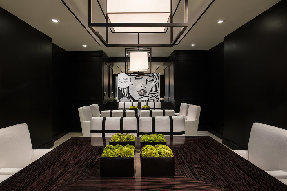 Large modern enclosed dining room in Miami with black walls.