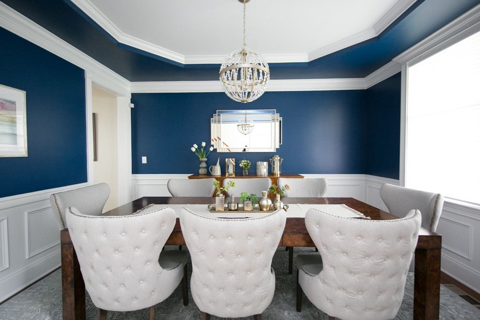 Large contemporary enclosed dining room in Raleigh with blue walls, medium hardwood flooring, no fireplace and brown floors.