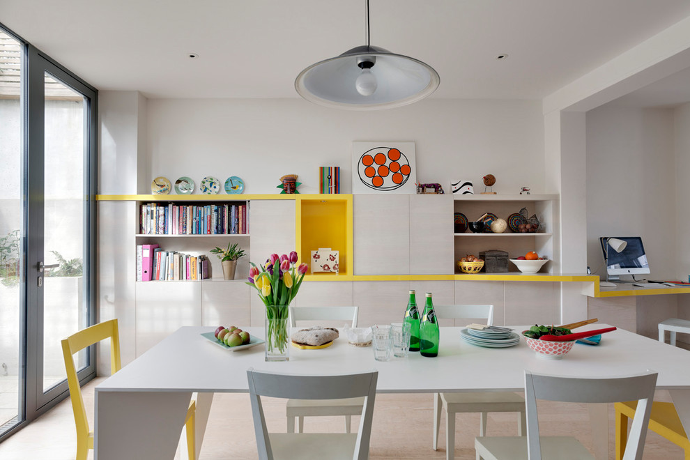 Design ideas for a contemporary dining room in London with white walls.