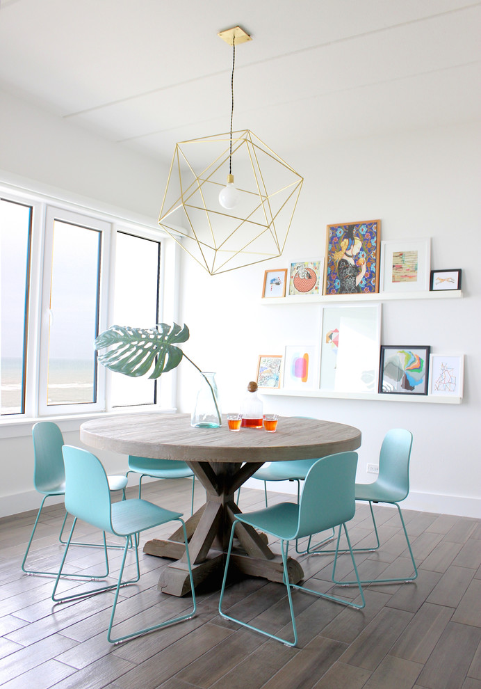 Photo of a contemporary dining room in Austin with white walls.