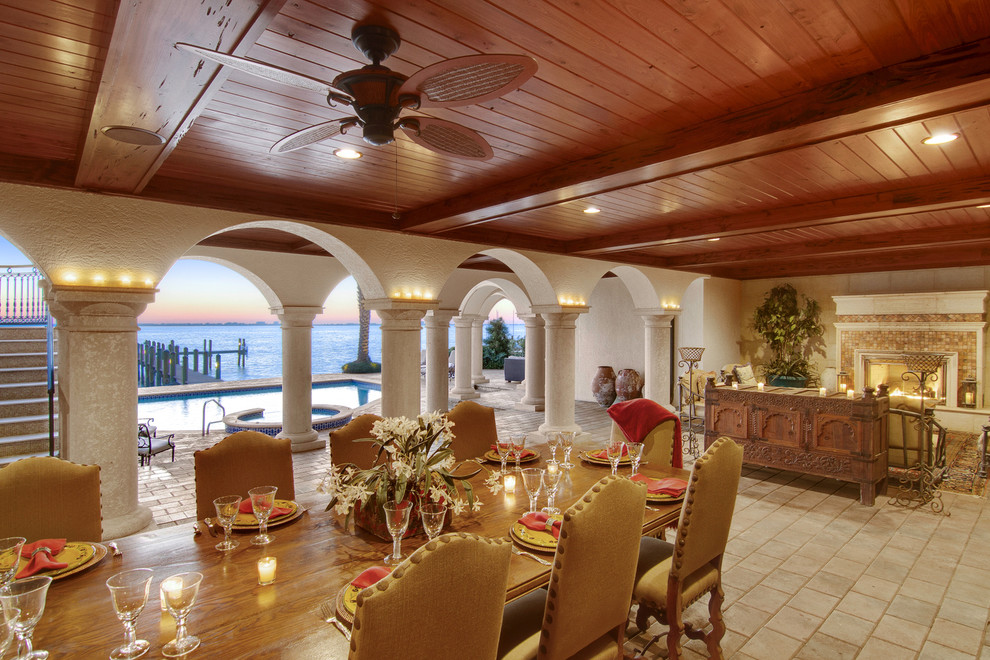 Mediterranean dining room in Tampa with beige walls.