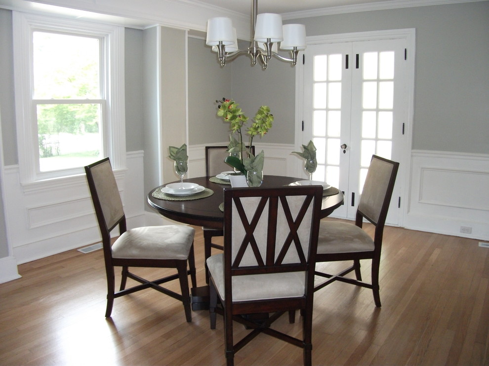 Inspiration for a timeless light wood floor enclosed dining room remodel in Philadelphia with gray walls