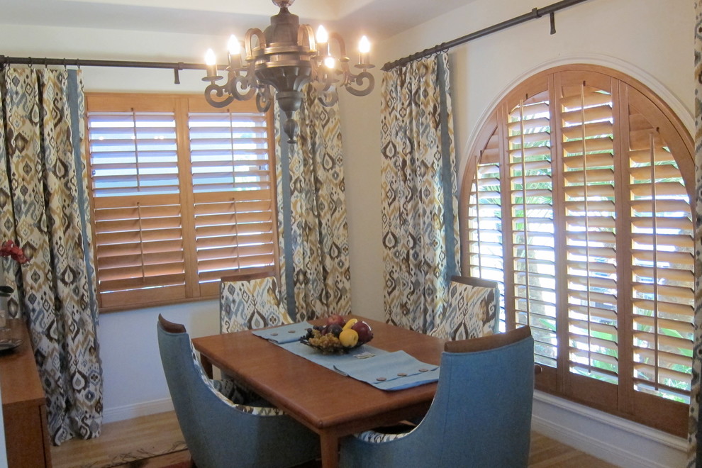 This is an example of a medium sized rustic dining room in Los Angeles with beige walls.