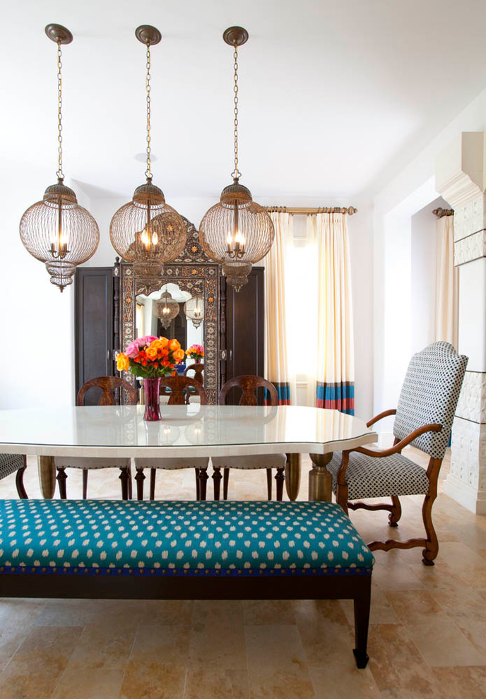Dining room - mediterranean dining room idea in Houston with white walls