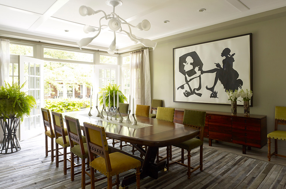 Example of a mid-sized 1950s enclosed dining room design in New York with green walls