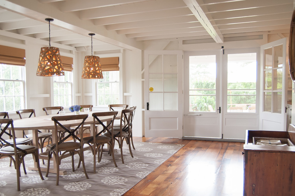 Large beach style medium tone wood floor enclosed dining room photo in Bridgeport with white walls and no fireplace